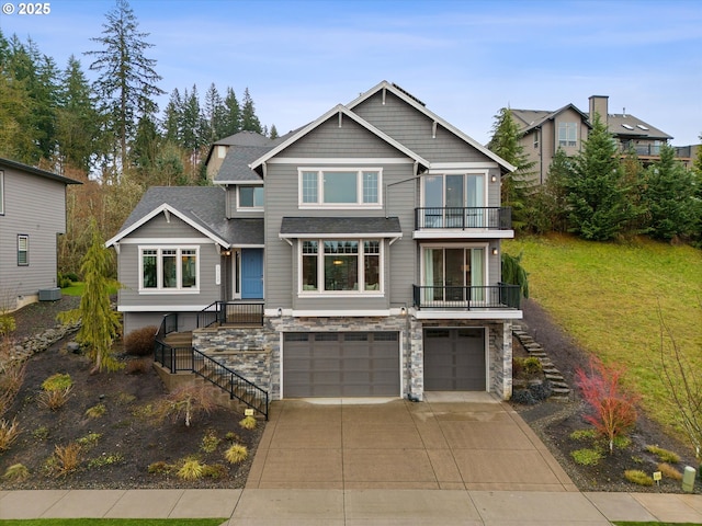 view of front of home with stairway, cooling unit, driveway, an attached garage, and stone siding