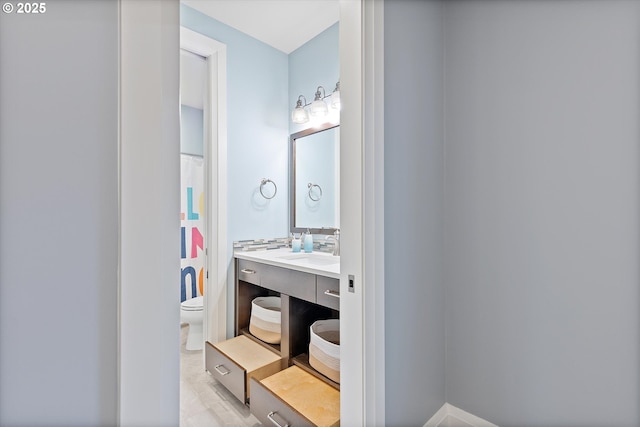 bathroom with vanity and toilet