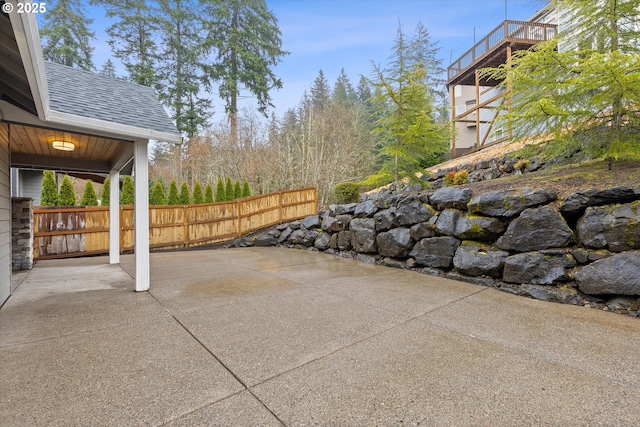 view of patio featuring fence