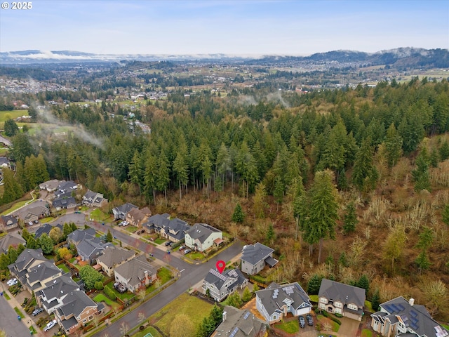 bird's eye view with a residential view and a wooded view