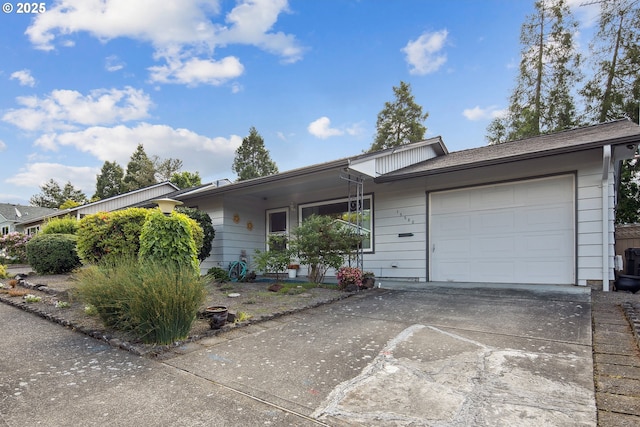 15580 SW Royalty Pkwy, Portland, OR 97224 - ranch-style house featuring an attached garage and driveway