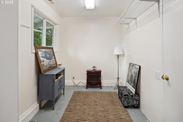 15580 SW Royalty Pkwy, Portland, OR 97224 - hall featuring baseboards, concrete flooring, and ornamental molding