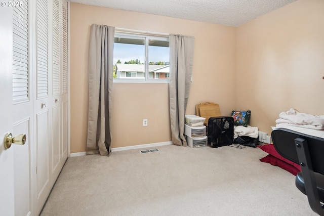 15580 SW Royalty Pkwy, Portland, OR 97224 - bedroom with carpet flooring, baseboards, and a textured ceiling