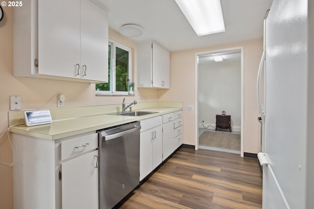 15580 SW Royalty Pkwy, Portland, OR 97224 - kitchen with dishwasher, freestanding refrigerator, a sink, dark wood-style flooring, and light countertops