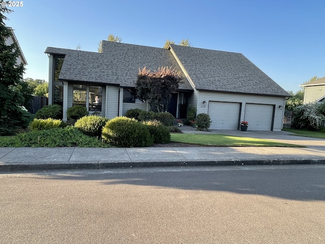 2145 Rock Ledge Dr, Keizer, OR 97303 - view of front facade featuring a garage, concrete driveway, and roof with shingles