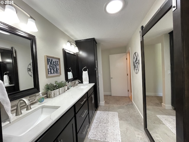 2145 Rock Ledge Dr, Keizer, OR 97303 - bathroom with double vanity and a textured ceiling