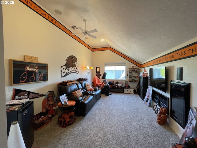 2145 Rock Ledge Dr, Keizer, OR 97303 - living room with vaulted ceiling, carpet, ceiling fan, and a textured ceiling