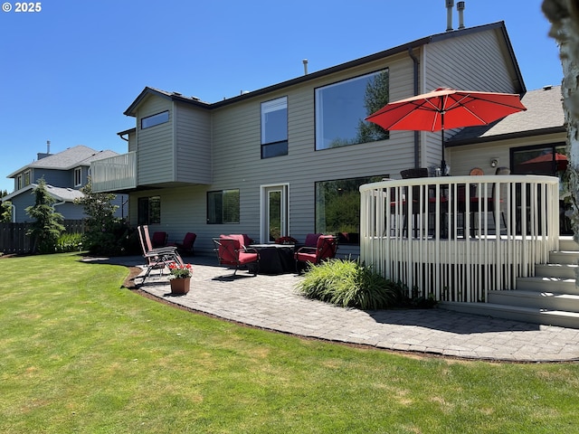 2145 Rock Ledge Dr, Keizer, OR 97303 - back of property with a patio area, a deck, and a garage
