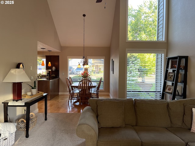 2145 Rock Ledge Dr, Keizer, OR 97303 - living room featuring high vaulted ceiling, plenty of natural light, wood finished floors, and ceiling fan