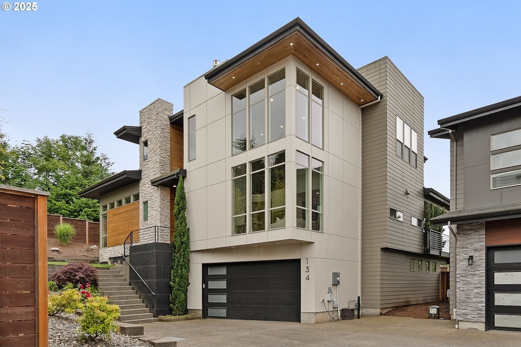 134 N 45th Cir, Camas, WA 98607 - view of front of property with stairs, a garage, and concrete driveway
