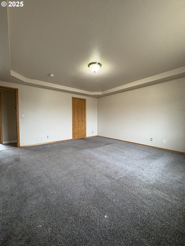 986 Arthur Ave, Cottage Grove, OR 97424 - carpeted spare room with baseboards and a tray ceiling
