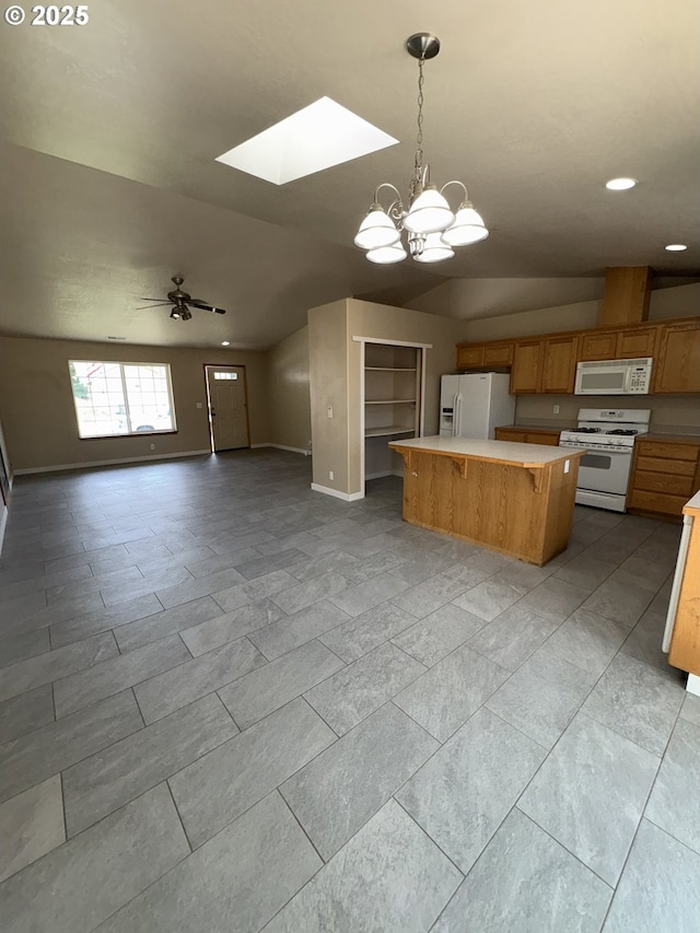 986 Arthur Ave, Cottage Grove, OR 97424 - kitchen with white appliances, light countertops, open floor plan, a center island, and lofted ceiling