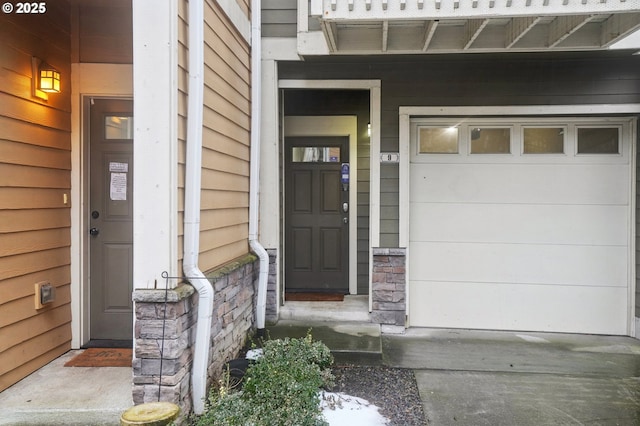 doorway to property featuring a garage