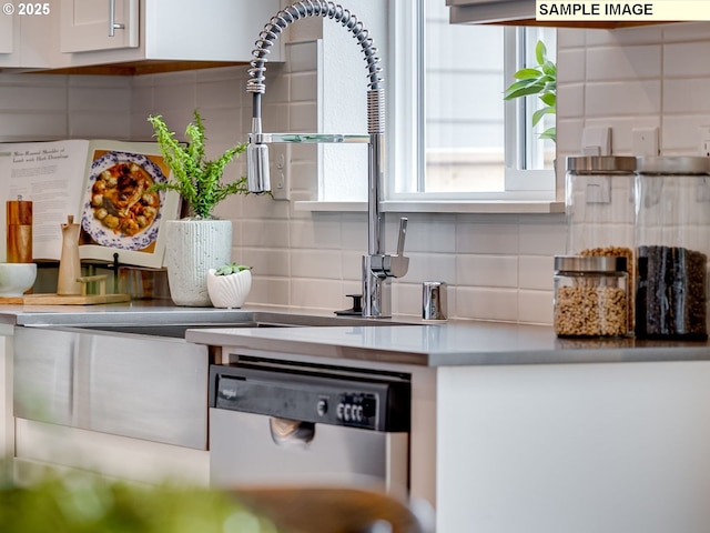 348 NW 29th Way, Battle Ground, WA 98604 - kitchen featuring stainless steel dishwasher, backsplash, and white cabinetry
