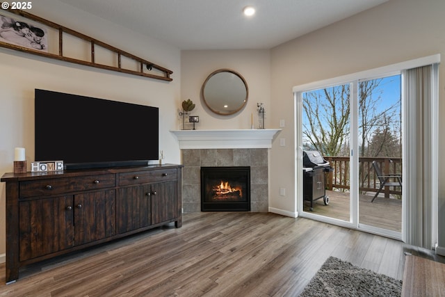 unfurnished living room featuring a fireplace and light hardwood / wood-style flooring