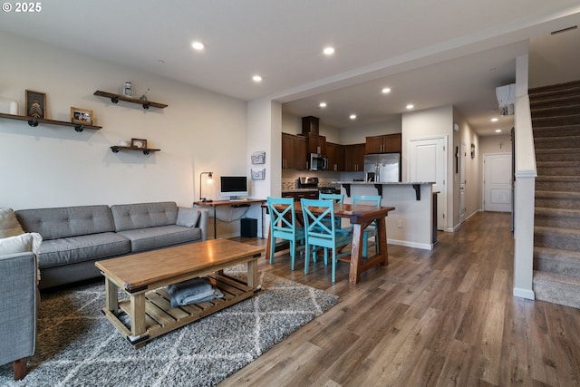 living room featuring dark wood-type flooring