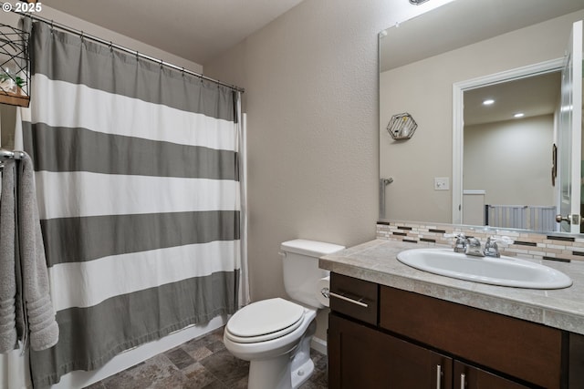 bathroom featuring toilet, a shower with curtain, backsplash, and vanity