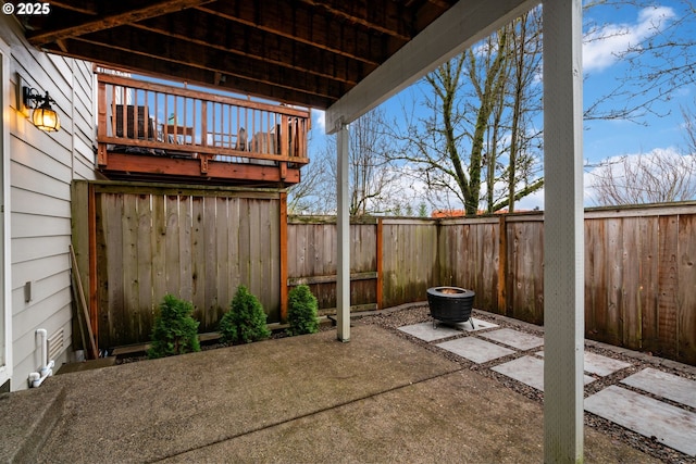 view of patio / terrace with an outdoor fire pit