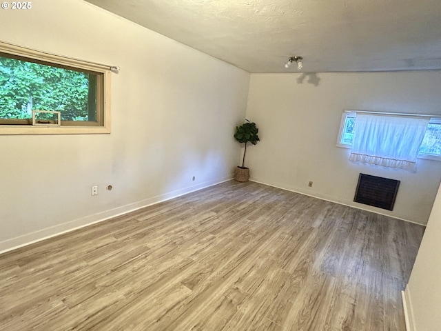 21223 NW Bendemeer Rd, Hillsboro, OR 97124 - spare room with wood finished floors and baseboards