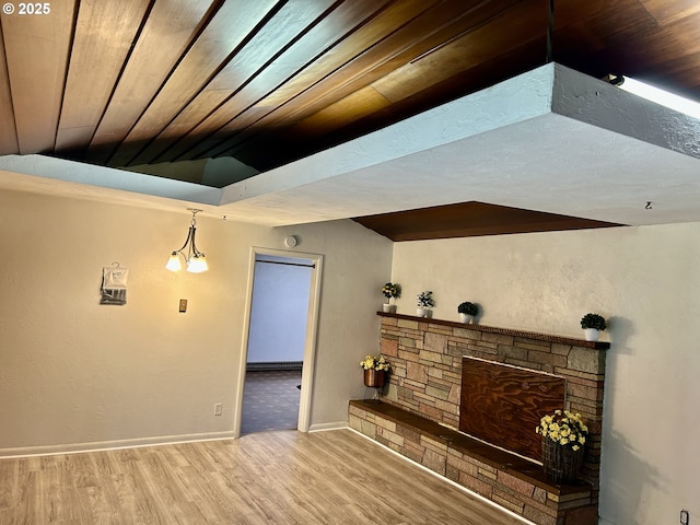 21223 NW Bendemeer Rd, Hillsboro, OR 97124 - unfurnished living room with wood finished floors, a stone fireplace, vaulted ceiling, and wood ceiling