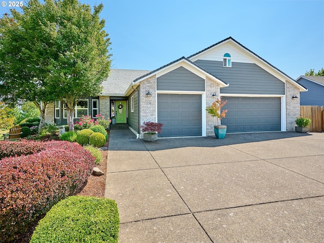 ranch-style house featuring concrete driveway, brick siding, fence, and an attached garage