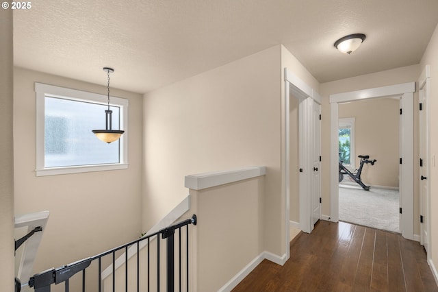 17760 SW Robert Ln, Beaverton, OR 97078 - corridor featuring an upstairs landing, dark wood finished floors, and a textured ceiling