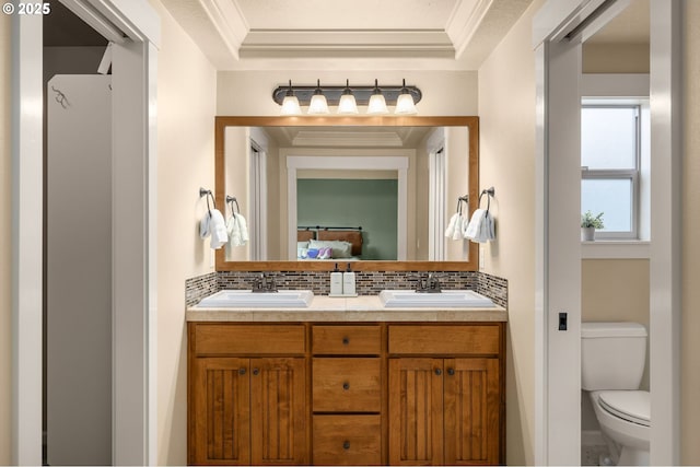 17760 SW Robert Ln, Beaverton, OR 97078 - bathroom featuring decorative backsplash, double vanity, crown molding, and connected bathroom