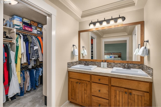 17760 SW Robert Ln, Beaverton, OR 97078 - bathroom featuring tasteful backsplash, double vanity, crown molding, a spacious closet, and a raised ceiling
