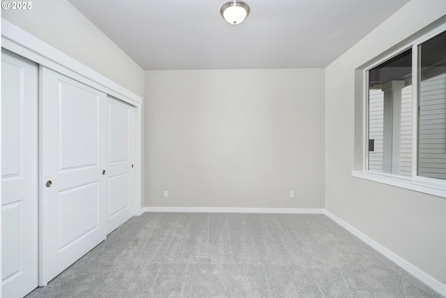 1624 NE Josephine Ct Unit 177, Estacada, OR 97023 - unfurnished bedroom featuring carpet floors, a closet, and baseboards
