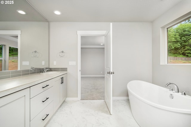 1624 NE Josephine Ct Unit 177, Estacada, OR 97023 - bathroom featuring marble finish floors, vanity, a soaking tub, recessed lighting, and baseboards