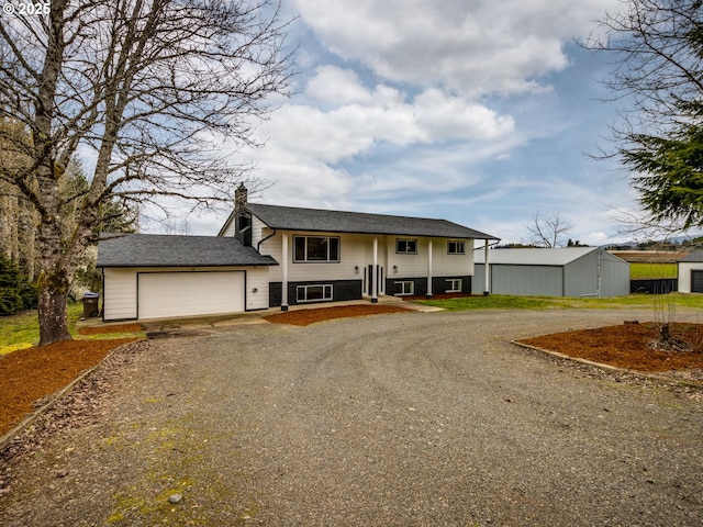 33133 SE Dodge Park Blvd, Gresham, OR 97080 - split foyer home featuring gravel driveway and a garage