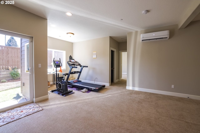 exercise room featuring carpet, a wall mounted air conditioner, baseboards, and recessed lighting