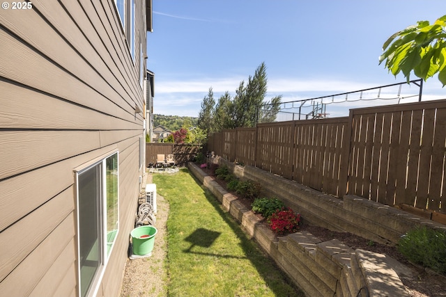 view of yard with a fenced backyard