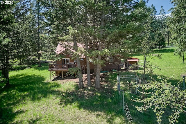 83863 Ollokot Ln, Joseph, OR 97846 - view of green lawn featuring a wooden deck and a wooded view