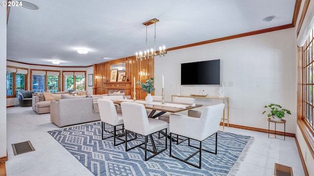 dining space featuring an inviting chandelier and ornamental molding