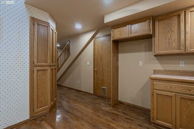 kitchen with tile countertops and dark hardwood / wood-style floors