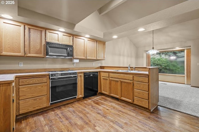 kitchen with pendant lighting, black appliances, lofted ceiling with beams, sink, and an inviting chandelier