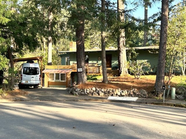 view of front of home featuring a carport and driveway