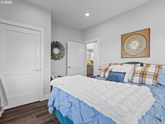 bedroom with dark wood-type flooring