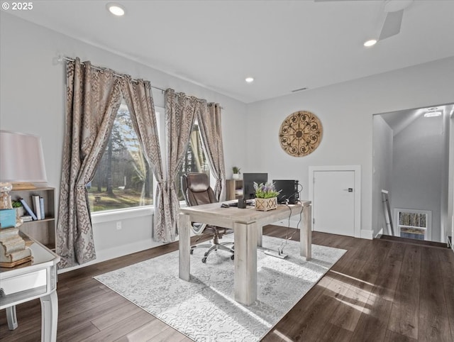 office space featuring ceiling fan and dark hardwood / wood-style flooring