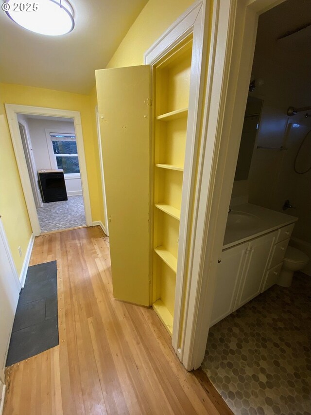 564566 Alameda Ave, Astoria, OR 97103 - hallway featuring hardwood / wood-style floors and baseboards