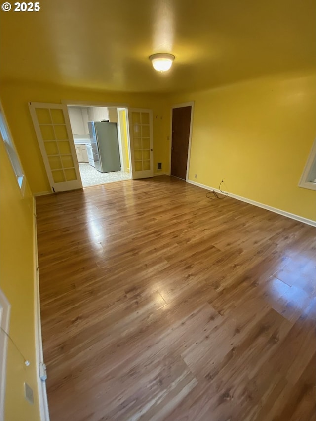 564566 Alameda Ave, Astoria, OR 97103 - empty room with wood finished floors and baseboards