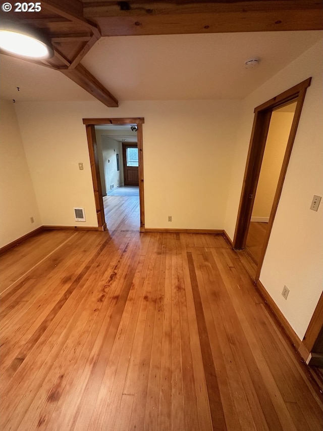 564566 Alameda Ave, Astoria, OR 97103 - empty room with baseboards, light wood-style floors, beam ceiling, and a smoke detector