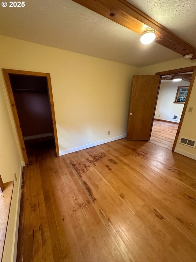 564566 Alameda Ave, Astoria, OR 97103 - unfurnished bedroom with hardwood / wood-style floors and baseboards