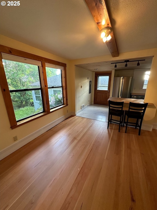 564566 Alameda Ave, Astoria, OR 97103 - unfurnished dining area featuring light wood-style floors and baseboards