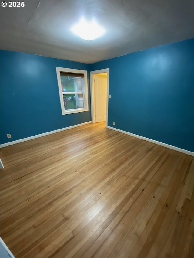 564566 Alameda Ave, Astoria, OR 97103 - empty room with wood finished floors and baseboards