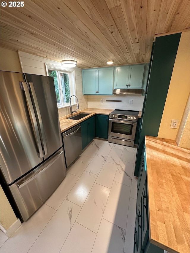 564566 Alameda Ave, Astoria, OR 97103 - kitchen featuring butcher block counters, appliances with stainless steel finishes, light marble finish flooring, a sink, and wood ceiling