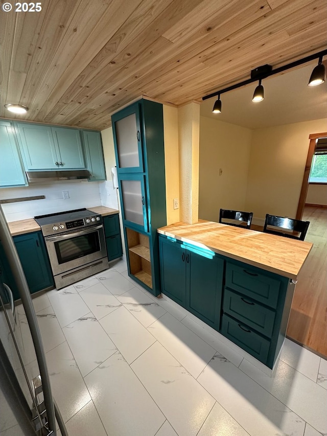 564566 Alameda Ave, Astoria, OR 97103 - kitchen with stainless steel electric range oven, butcher block countertops, a peninsula, light marble finish floors, and wooden ceiling