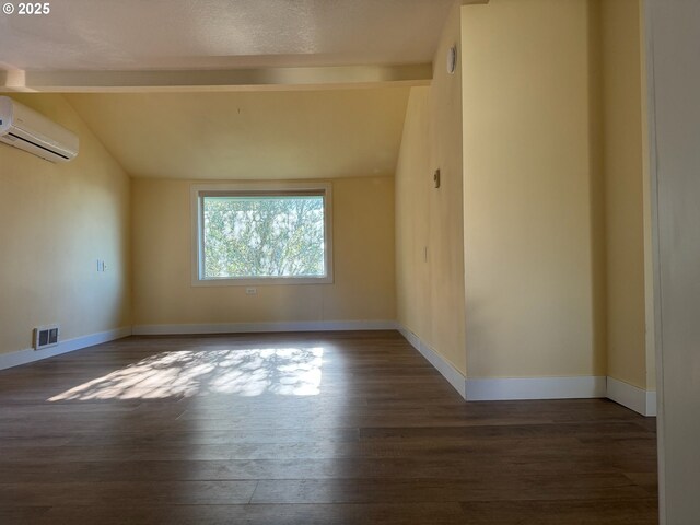 564566 Alameda Ave, Astoria, OR 97103 - spare room with a wall mounted air conditioner, wood finished floors, and baseboards