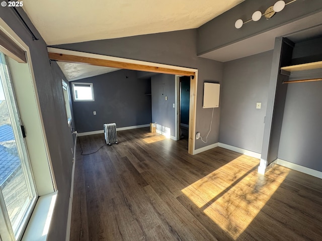 564566 Alameda Ave, Astoria, OR 97103 - unfurnished bedroom featuring lofted ceiling, radiator, wood finished floors, and baseboards